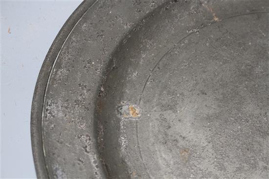 A George III pewter charger by William Hogg of Newcastle, diameter 34cm and a dished plate 27cm
